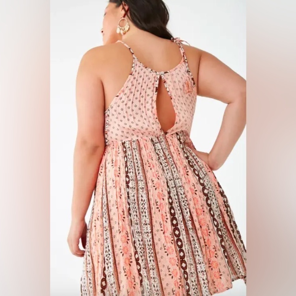 The bandana cami dress with an elasticized waist and a buttoned keyhole back
